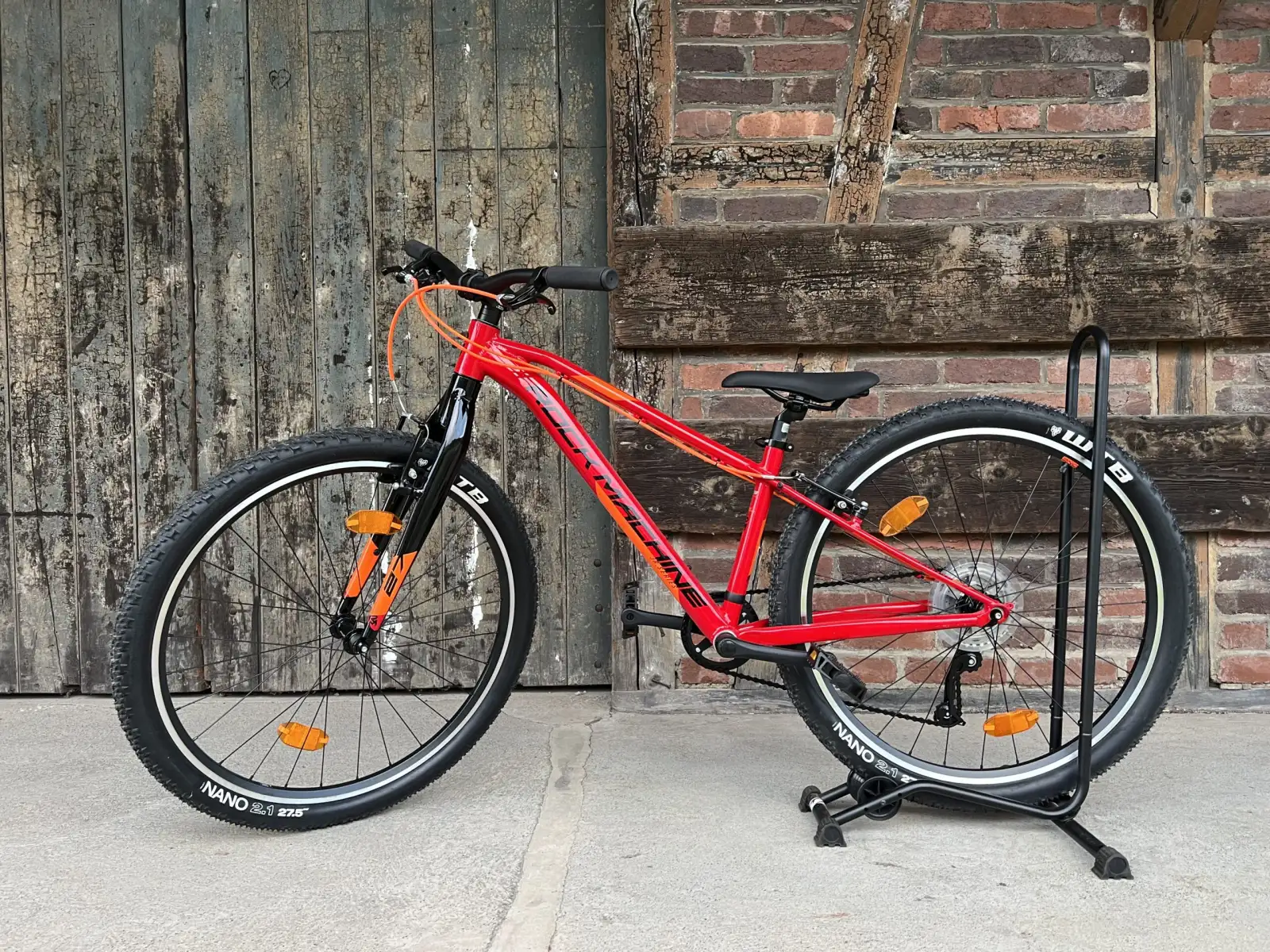 Rock Machine Thunder 27 VB dziecięcy rower górski Gloss Red/Black/Orange